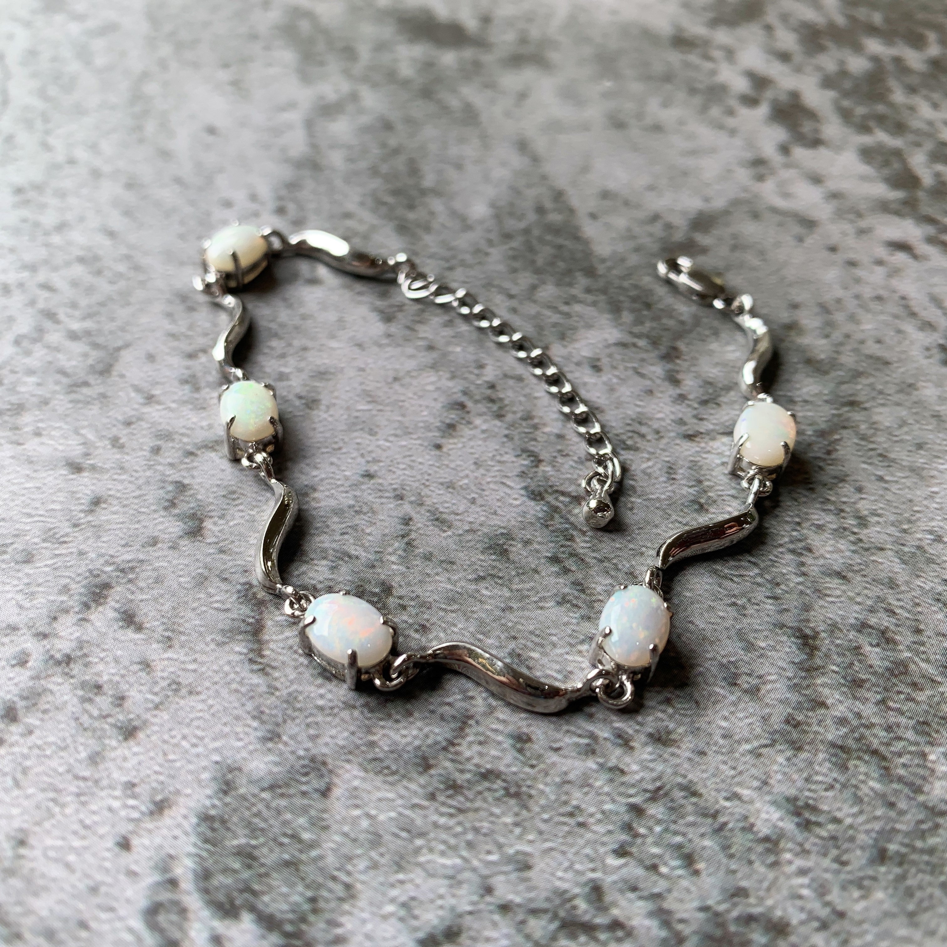 Sterling Silver wave 8x6mm Oval White Opal bracelet - Masterpiece Jewellery Opal & Gems Sydney Australia | Online Shop