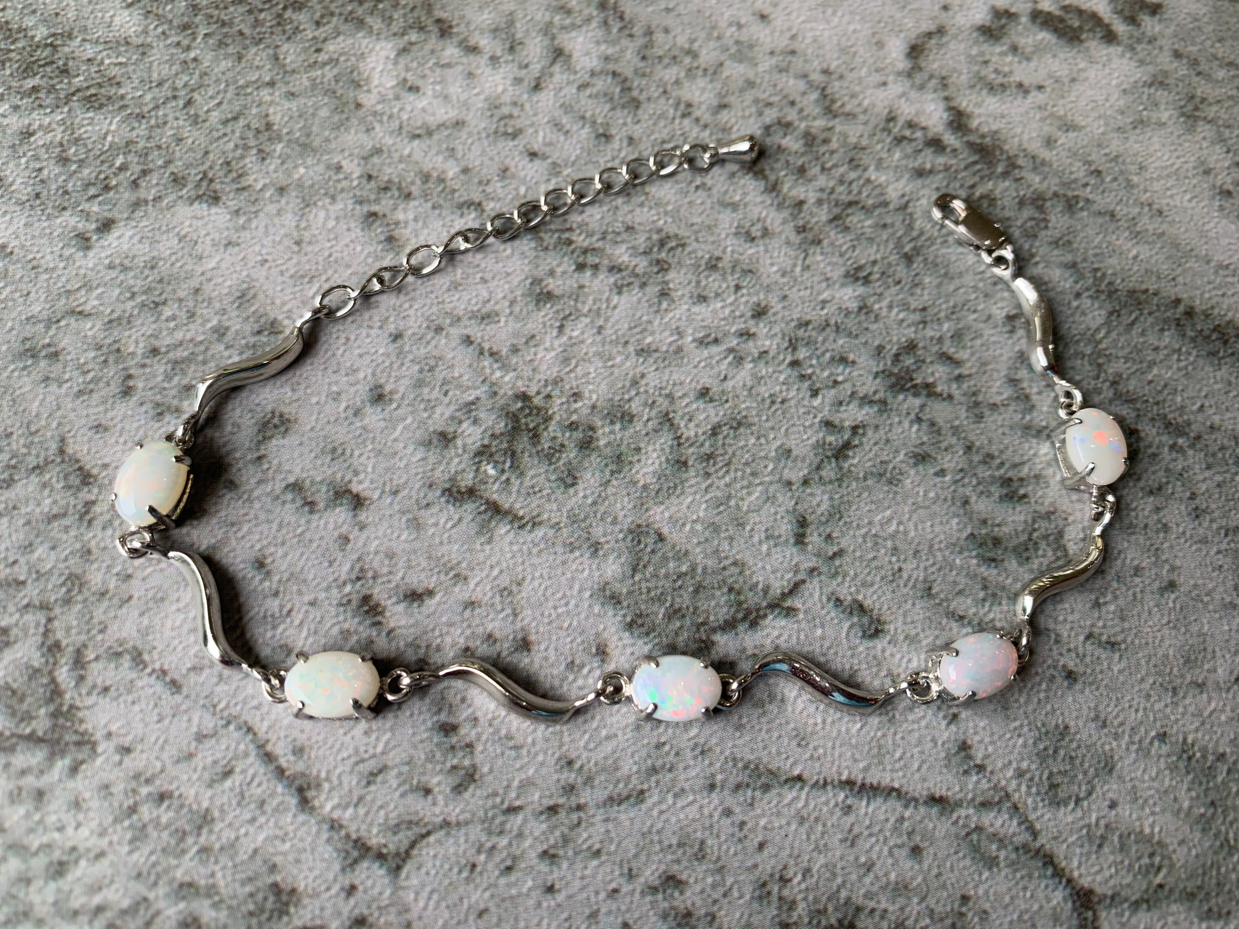 Sterling Silver wave 8x6mm Oval White Opal bracelet - Masterpiece Jewellery Opal & Gems Sydney Australia | Online Shop