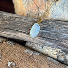 Solid Australian white opal pendant, 2.3ct oval stone with blue and green pinfire in 18kt yellow gold