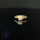 18kt Yellow Gold Black Opal 0.2 cross over diamond ring
