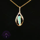 9kt yellow gold pendant with a 0.51ct triangular crystal opal in an open teardrop frame