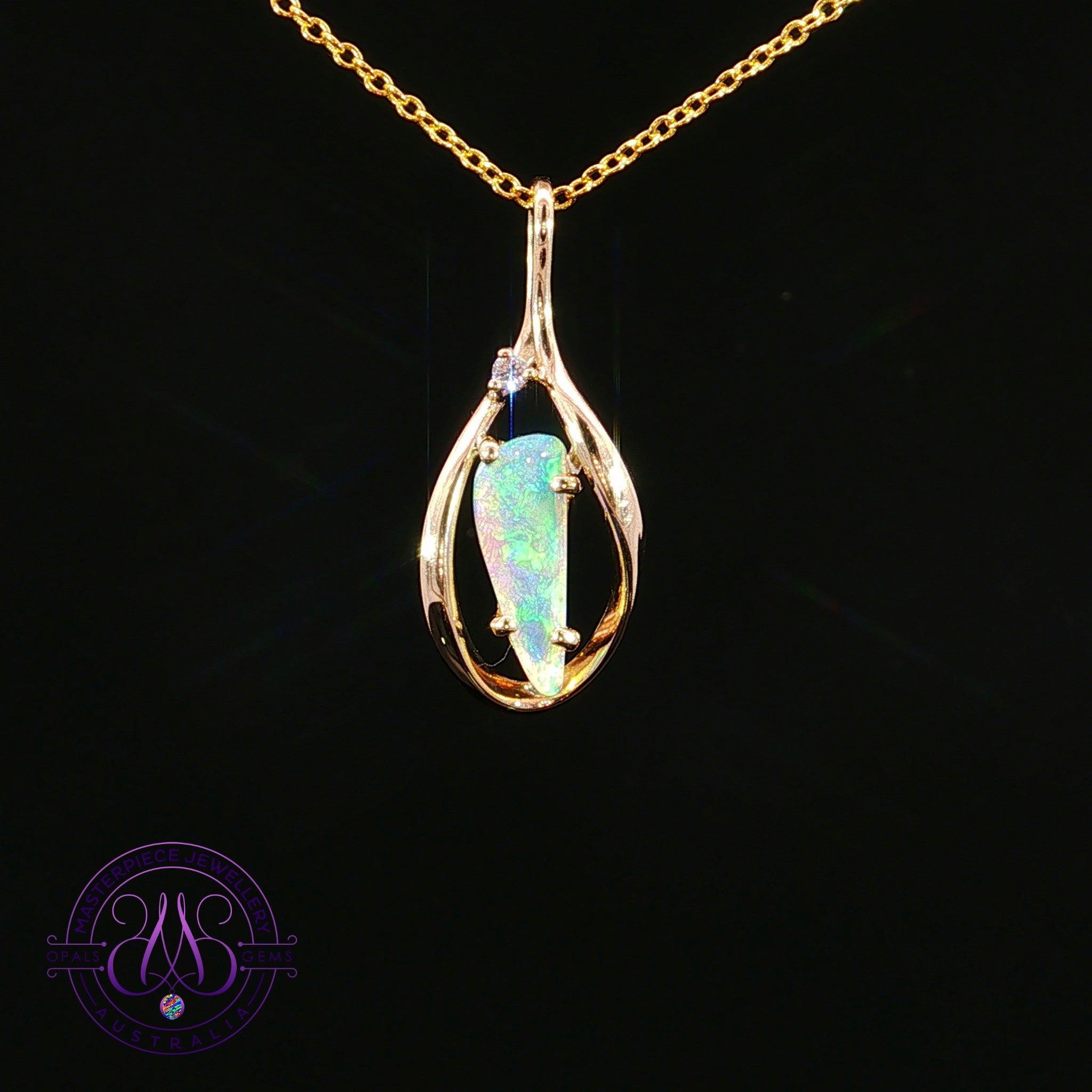 9kt yellow gold pendant with a 0.51ct triangular crystal opal in an open teardrop frame