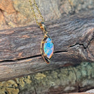 Marquise crystal opal showing blue and green play-of-colour in yellow gold