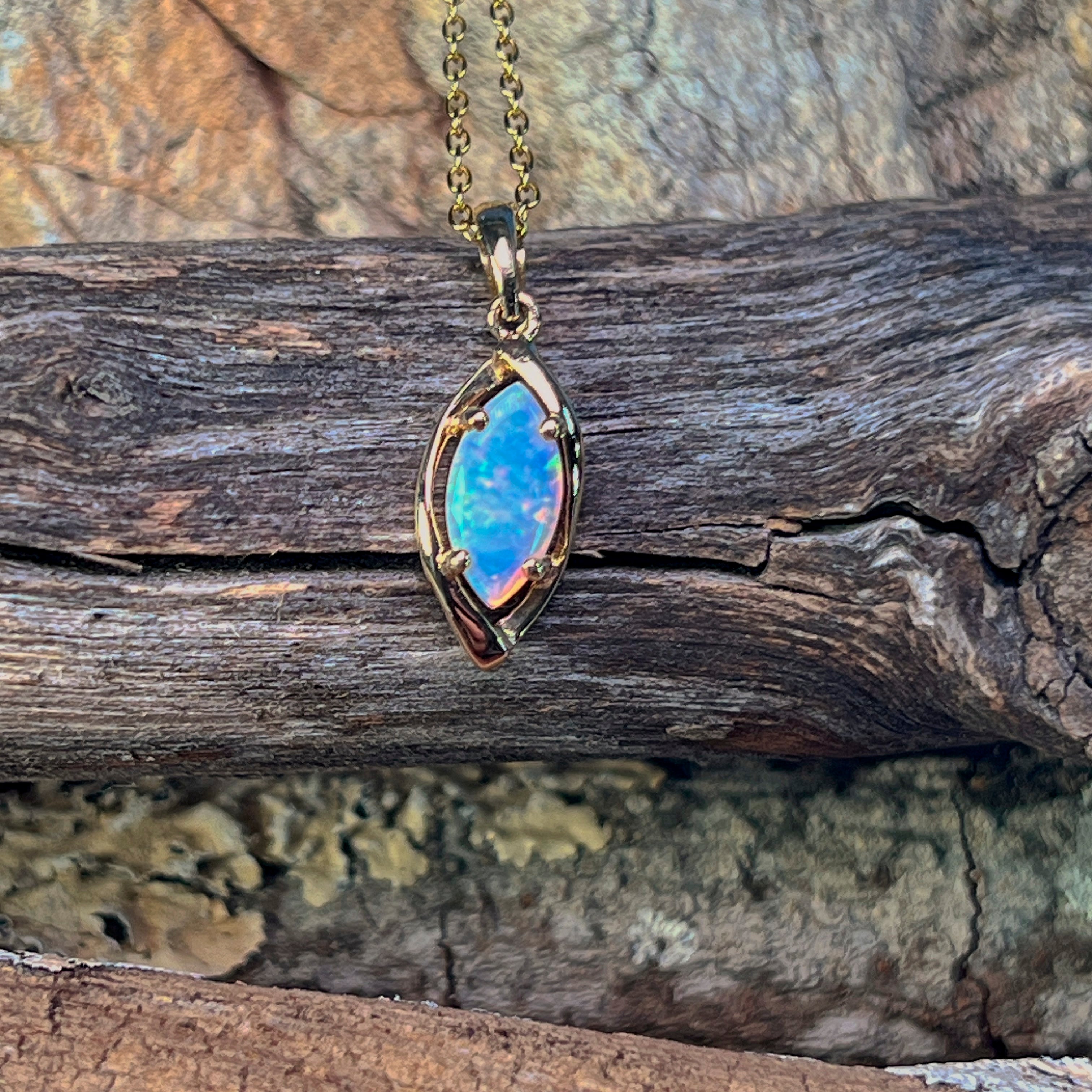 Close view of the marquise crystal opal and its claw setting