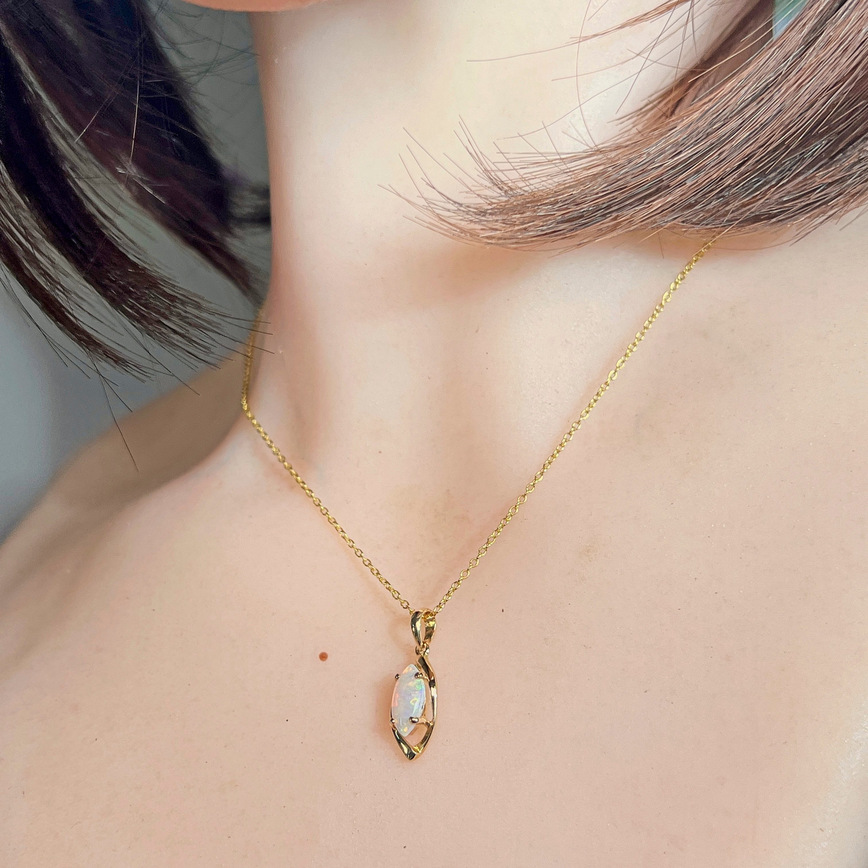 Marquise crystal opal pendant worn on the neckline