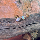 5.5mm round Australian crystal opals claw set in 9kt yellow gold studs