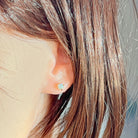 9kt yellow gold crystal opal stud shown worn, 5.5mm round