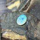 5.54ct crystal opal showing vivid blue and green play-of-colour across a translucent dome