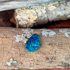 Top view of the 15.5x10mm pear shaped opal doublet showing blue and green play-of-colour