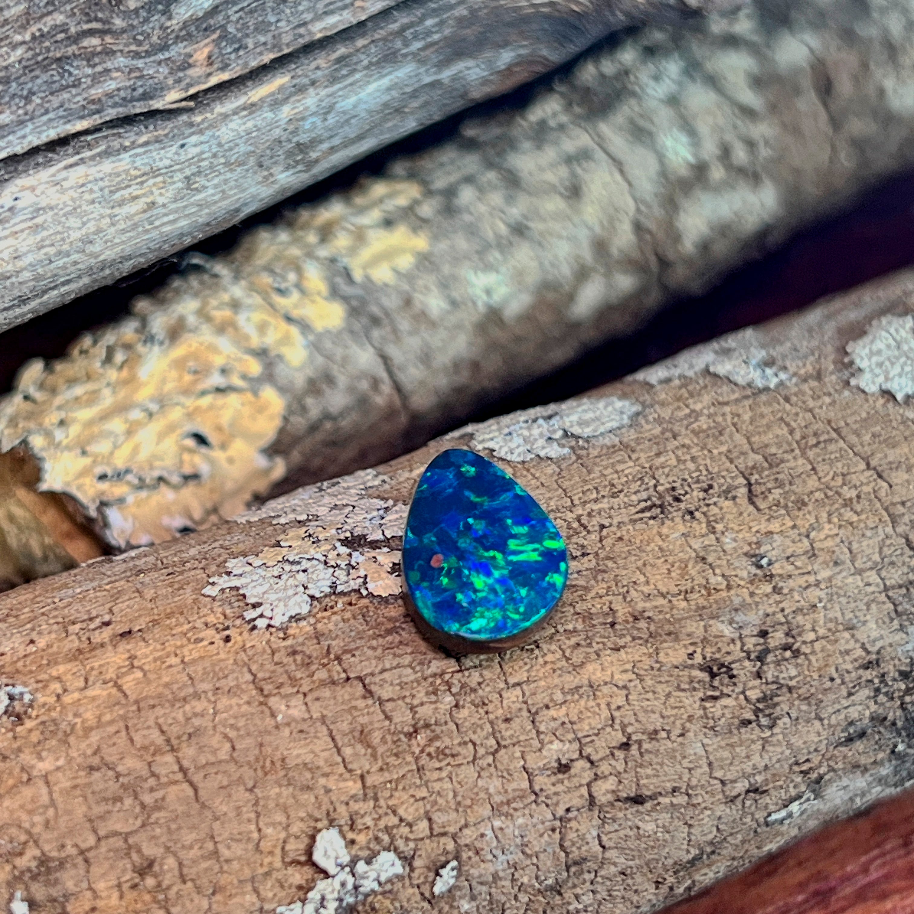Profile view of the drop shaped opal doublet showing colour across the face