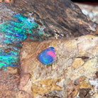 1.47ct Australian opal doublet on ironstone, rose-red flash rolling across a violet body