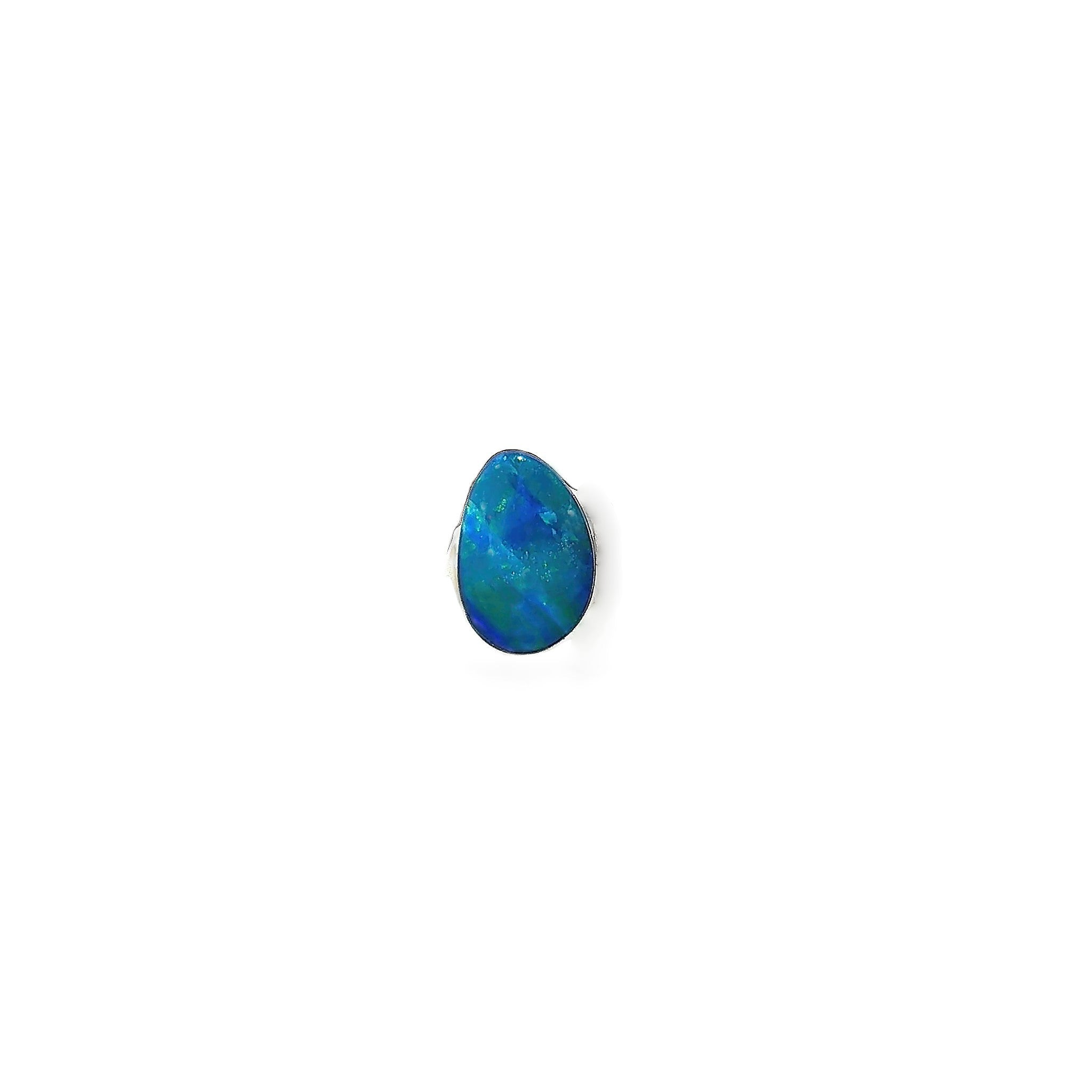 Australian opal doublet 0.52ct freeform, blue with green and yellow, on a white background