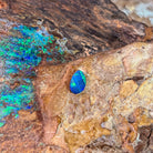 0.52ct Australian opal doublet on ironstone, a green flash across a blue violet body