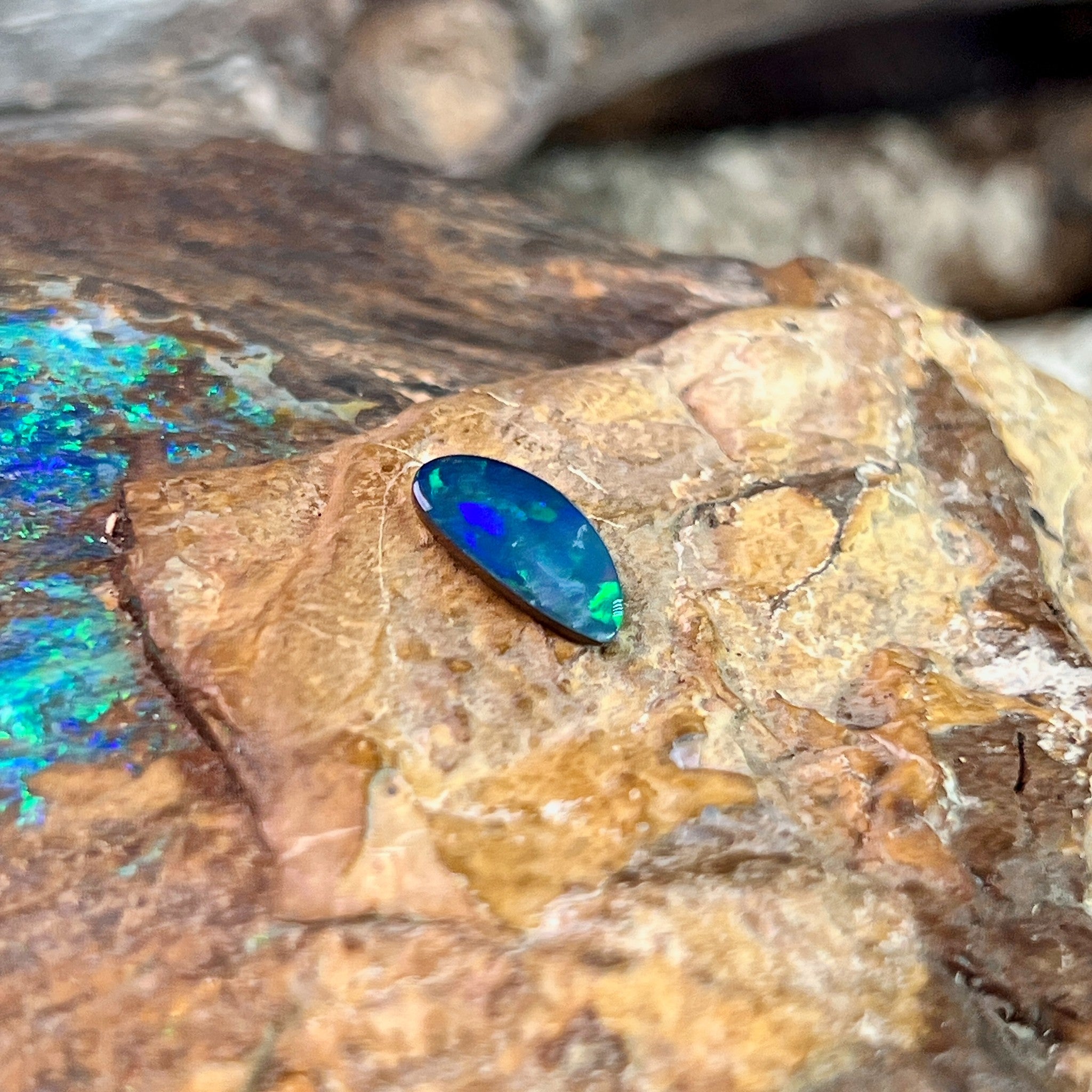 Green fire running the length of an 11.5x5.5mm Australian opal doublet, 0.88ct