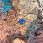 Magenta and blue play-of-colour in a freeform 0.70ct Australian opal doublet on ironstone