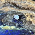 Loose solid black opal 0.85ct, oval, red, orange and yellow flashes, ready for a custom setting, on rock