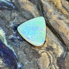 Solid Australian crystal opal 16.50ct, triangular 23.2x20.7mm, yellow and green with a hint of blue stripe, loose stone on rock