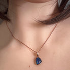 Australian opal triplet pendant worn at the neck, rose gold-plated silver, 11 x 8mm freeform stone
