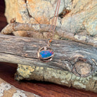 blue, yellow, green and red play-of-colour in a 12 x 11mm freeform Australian opal doublet pendant
