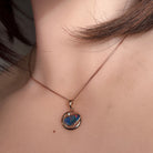 Australian opal doublet pendant worn at the neck, rose gold-plated silver, 12 x 11mm freeform stone