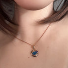 freeform Australian opal doublet pendant worn, rose gold-plated silver, blue, yellow, green and red
