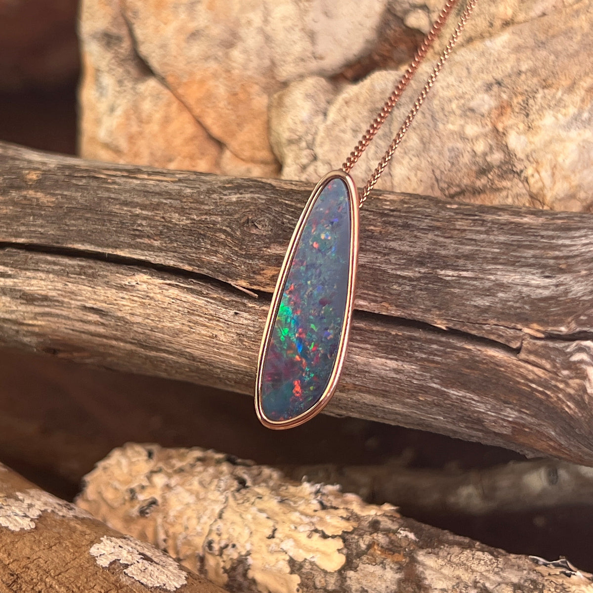 rose gold-plated silver Australian opal doublet pendant with a 27 x 8mm freeform stone