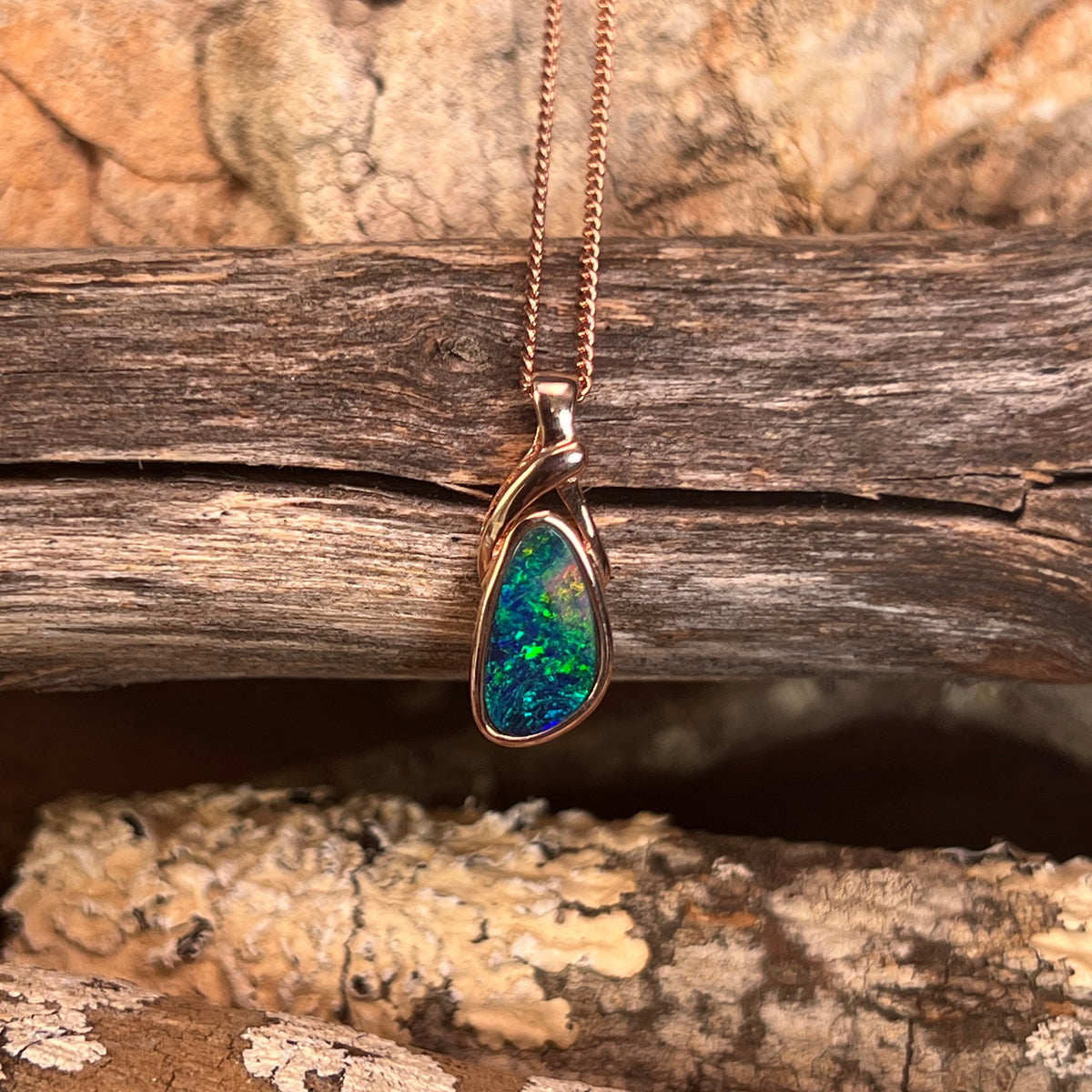 freeform Australian opal doublet pendant in rose gold-plated silver, 12 x 6.5mm, green, red and blue