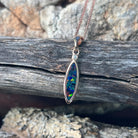 red, blue, green and violet play-of-colour in a 15 x 5mm marquise Australian opal doublet pendant