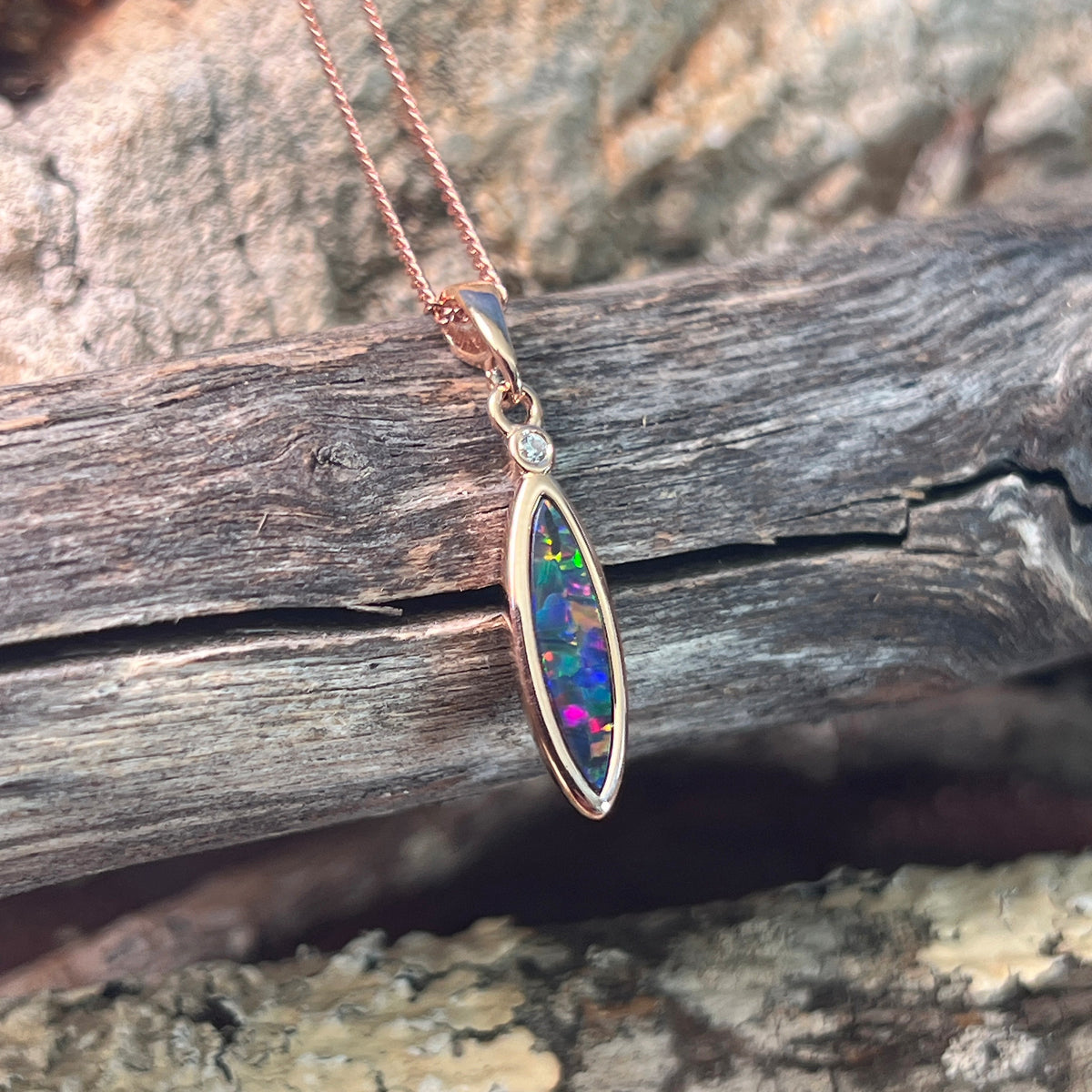 15 x 5mm Australian opal doublet pendant in rose gold-plated silver, red, blue, green and violet