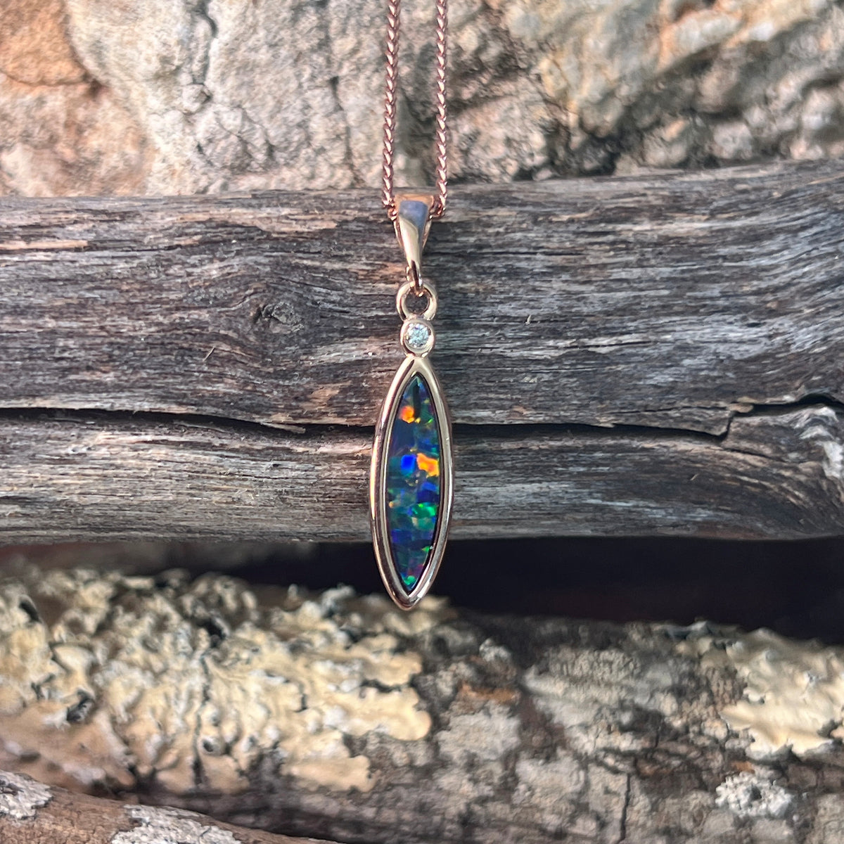 Australian opal doublet pendant, rose gold-plated silver, 15 x 5mm stone showing red, blue, green and violet