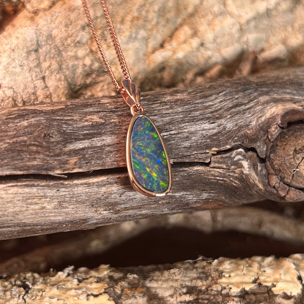 red, blue, green and violet Australian opal doublet, marquise, rose gold-plated silver pendant, 15 x 7.5mm