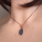 red, blue, green and violet Australian opal doublet pendant worn at the neck, rose gold-plated silver, 15 x 7.5mm