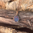 red, blue, green and violet play-of-colour in a 15 x 7.5mm marquise Australian opal doublet pendant