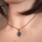 15 x 7.5mm marquise Australian opal doublet pendant worn at the neck, rose gold-plated silver