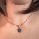 Australian opal doublet pendant worn at the neck, rose gold-plated silver, 15 x 7.5mm marquise stone