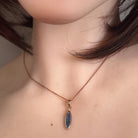Australian opal doublet pendant worn at the neck, rose gold-plated silver, 16 x 5mm marquise stone