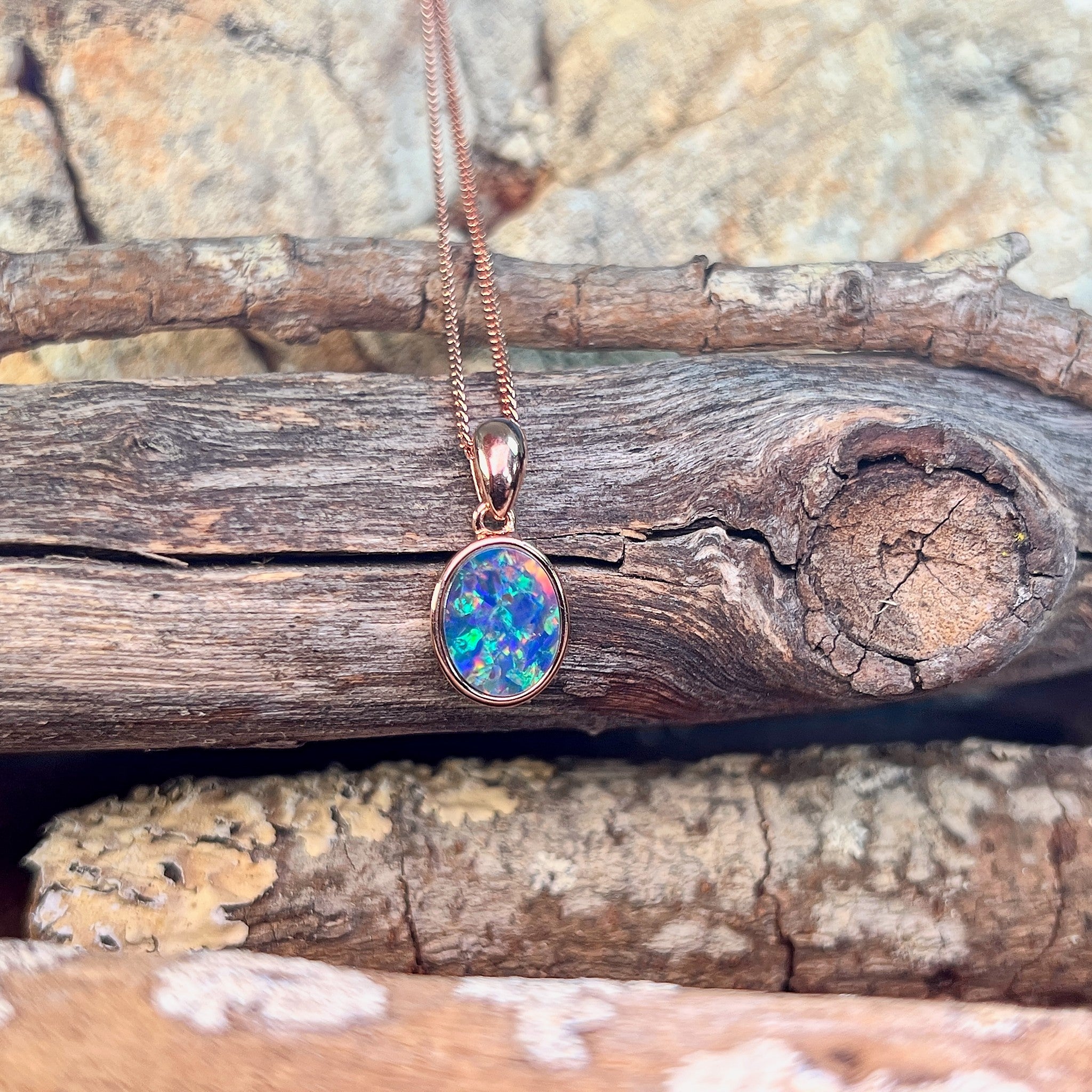 oval Australian opal doublet pendant in rose gold-plated silver, blue, yellow, green and red play-of-colour