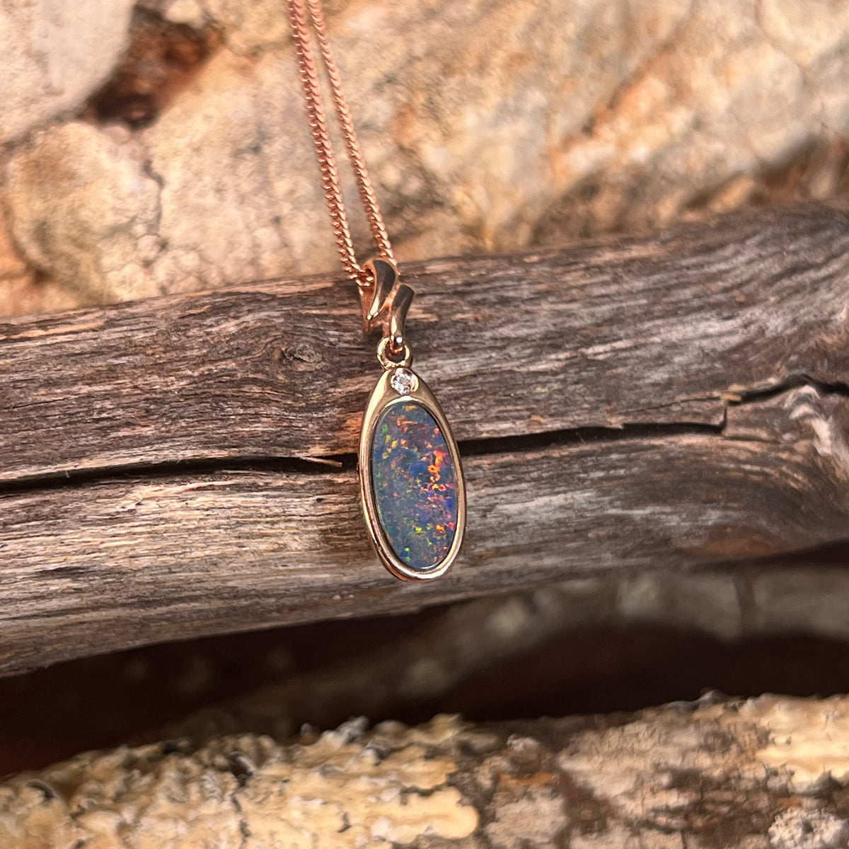 rose gold-plated silver Australian opal doublet pendant with a 12 x 6mm oval stone