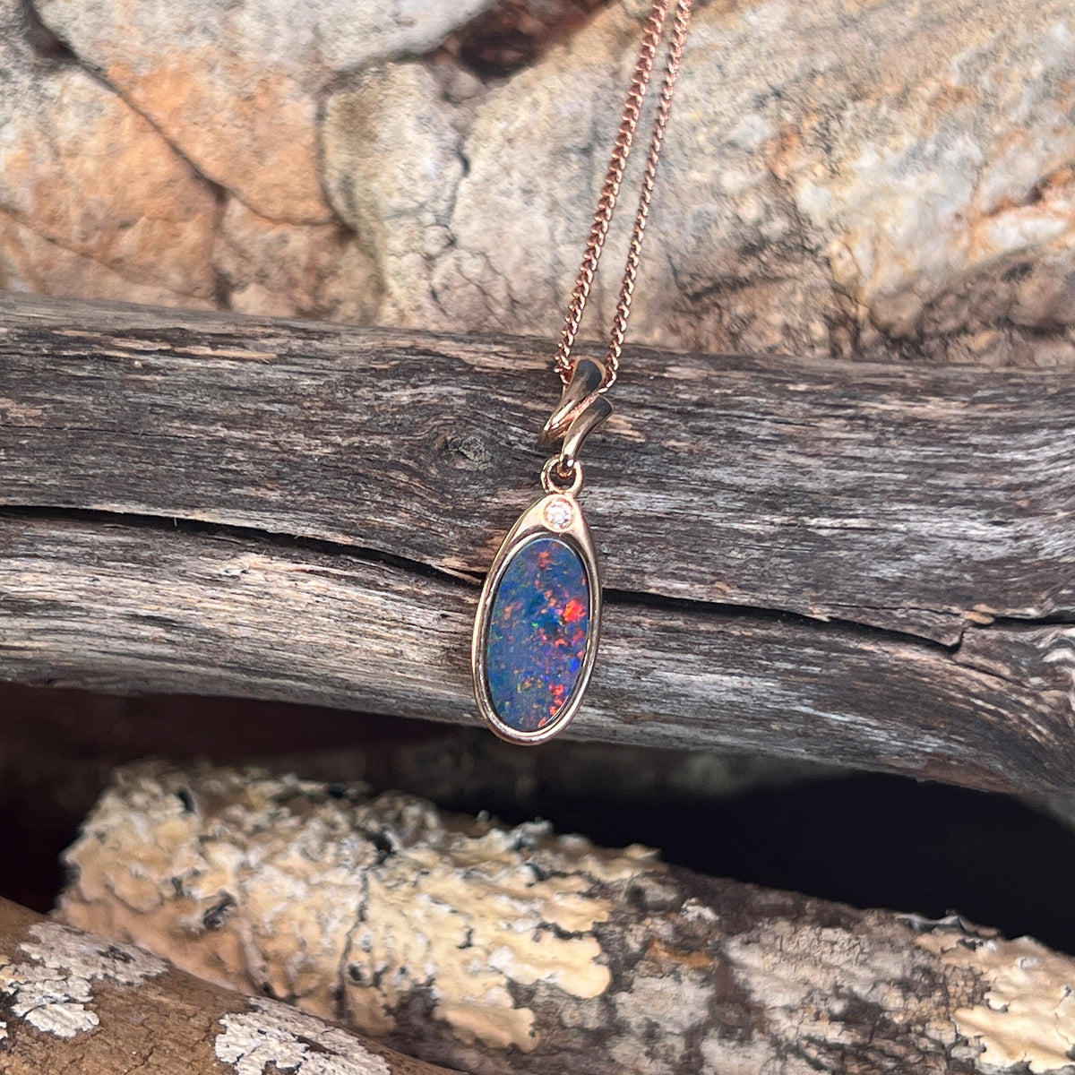 12 x 6mm Australian opal doublet pendant in rose gold-plated silver, red and blue