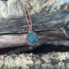 green, red, blue and yellow play-of-colour in a 10 x 8mm oval Australian opal doublet pendant