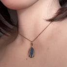 16.5 x 5.5mm pear-shaped Australian opal doublet pendant worn at the neck, rose gold-plated silver