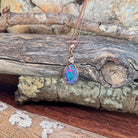 blue, red, yellow and green play-of-colour in a 11 x 7mm pear-shaped Australian opal doublet pendant