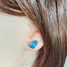 Worn Australian opal doublet earrings in rose gold-plated silver, red, blue and green, 10 x 8mm