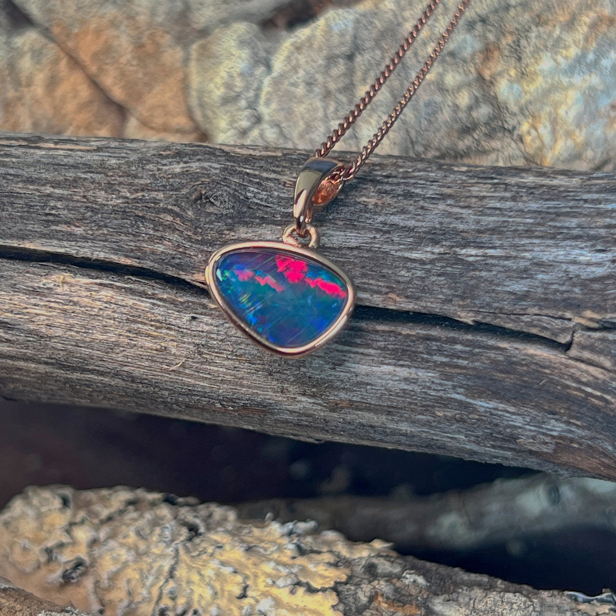 12 x 8mm Australian opal triplet pendant in yellow gold-plated silver, red, green and blue