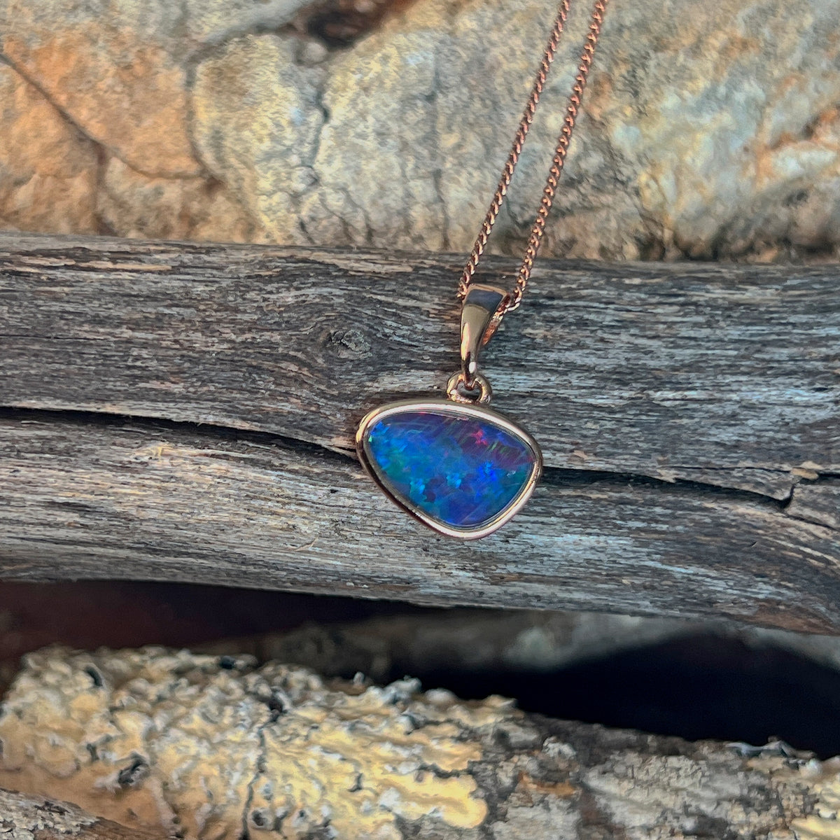 Australian opal triplet pendant, yellow gold-plated silver, 12 x 8mm stone showing red, green and blue