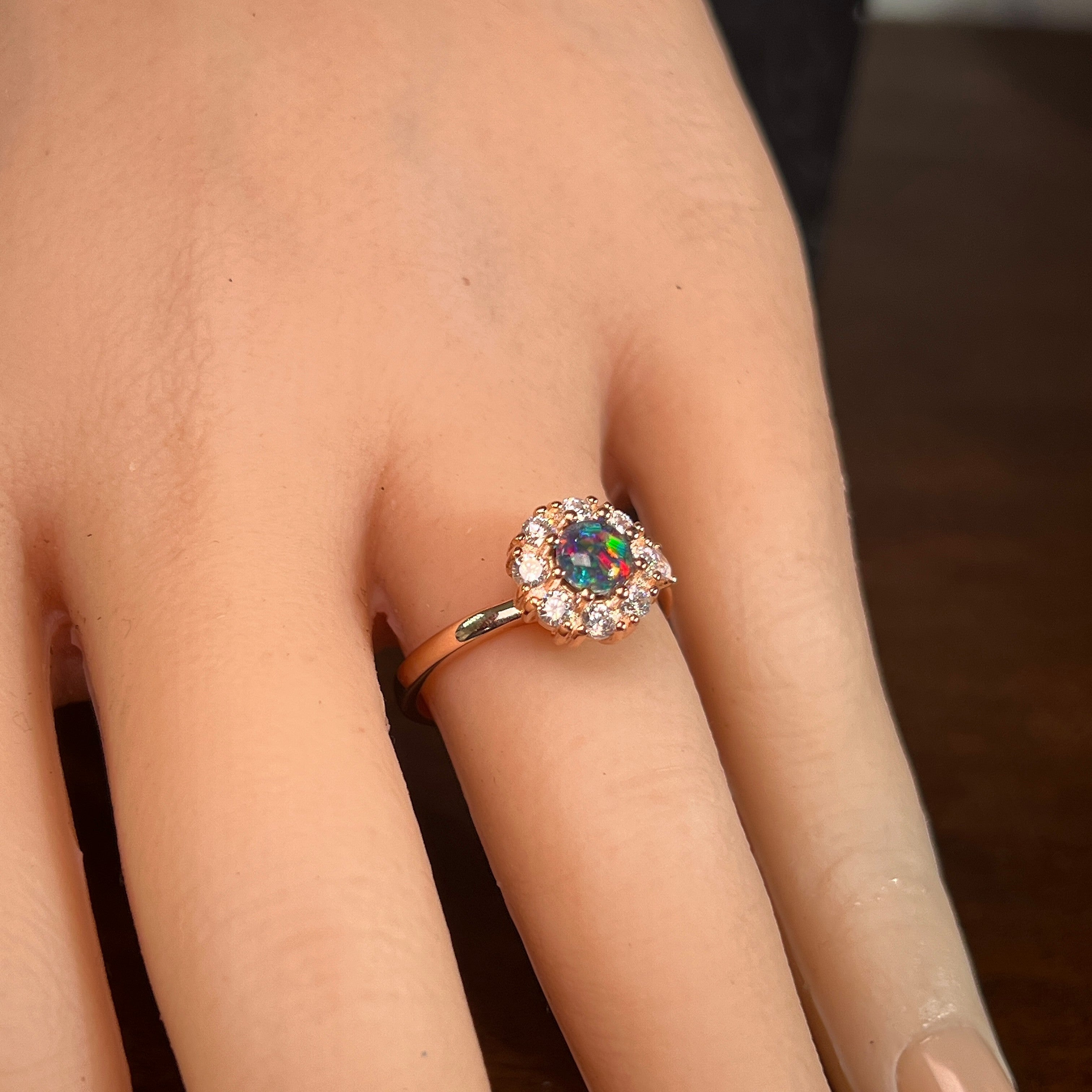 5mm round Australian opal triplet ring on the hand, rose gold-plated silver