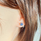 round Australian opal triplet earrings in rose gold-plated silver, worn on the ear
