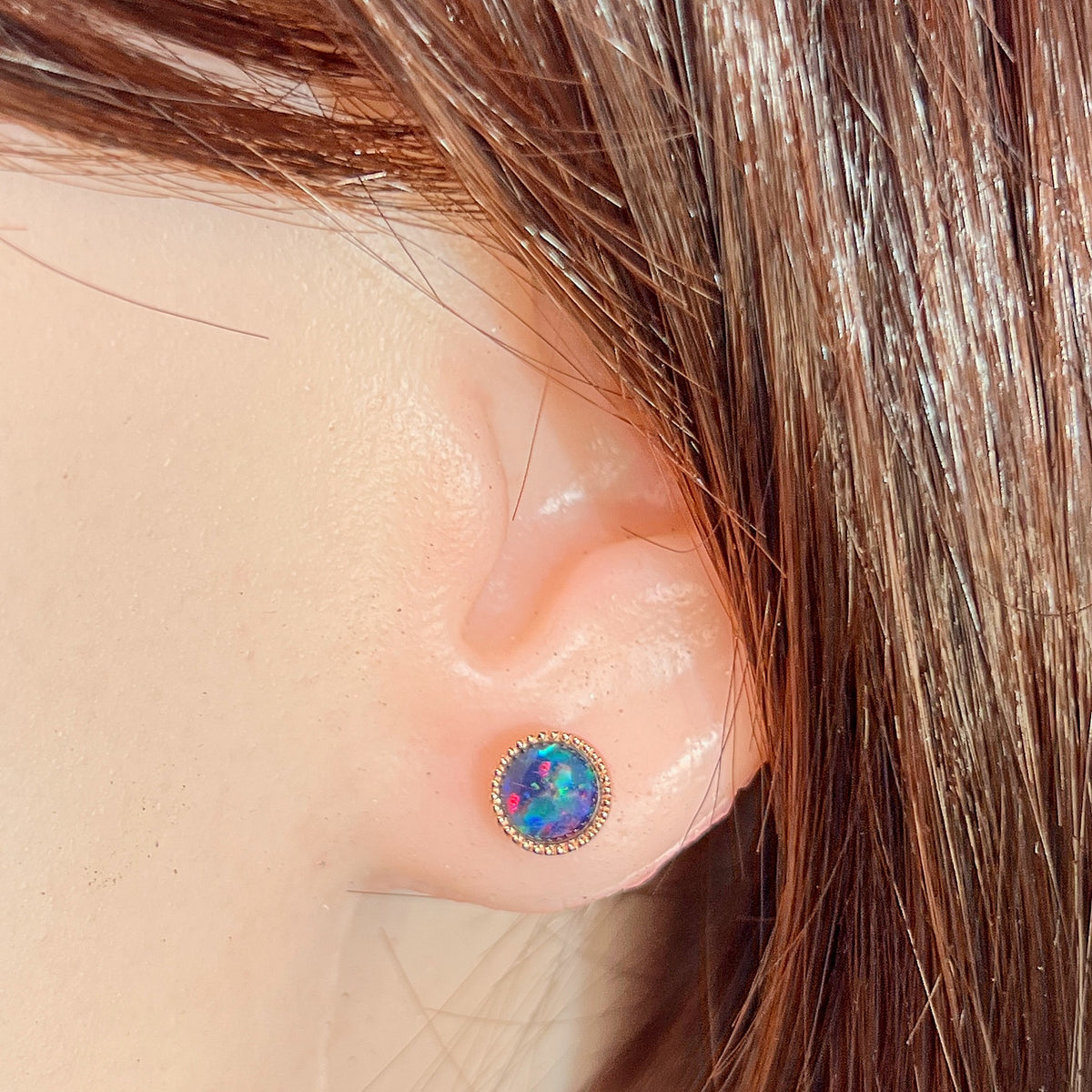 Australian opal triplet earrings worn on the ear, rose gold-plated silver, 6mm round stones
