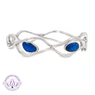 Sterling silver wave cut-out bangle set with a 3.92ct freeform blue-green Australian opal doublet