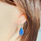 freeform Australian opal doublet earrings in sterling silver, worn on the ear